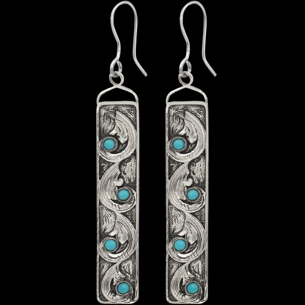 Who doesn't love turquoise?! Our Magnolia Earrings are built on a fine German Silver Base with hand engraved scrolls and small turquoise stones for a classy Western charm. Order now!